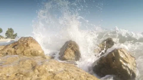 Waves breaking on rocks Stock Footage 26091550