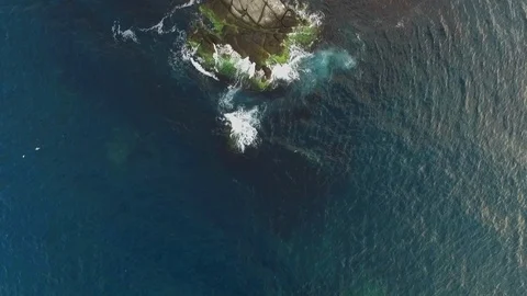 Waves breaking into the rocks Stock Footage 105573261