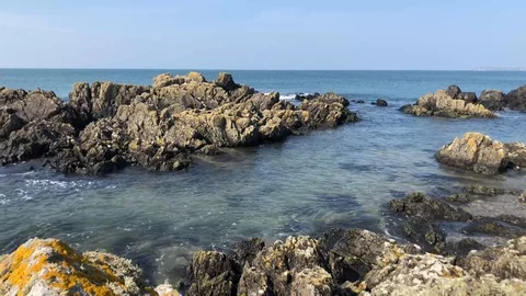 Waves breaking onto the rocks Stock Footage 106002285