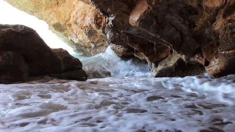Waves breaking on rocks Stock Footage 111358724