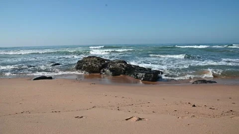 Waves breaking on rocks Stock Footage 336095939