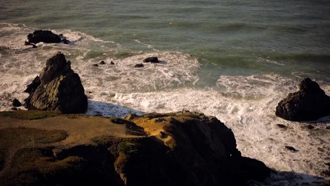 Waves breaking on rocks at low tide. Stock Footage 88342452