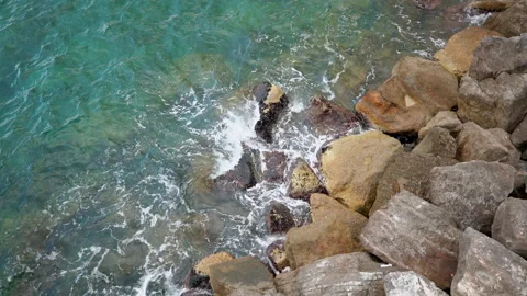 Waves breaking on rocks in the Mediterranean Sea in Italy. Stock Footage 158453744
