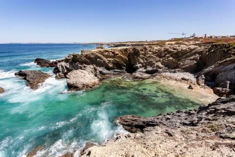 Waves breaking on the rocks. Stock Photos