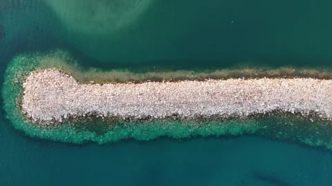 Waves breaking on the rocks of the pier. Concrete blocks in the sea Stock Footage 278793278