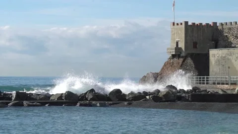 Waves breaking on the rocks in slow motion Stock Footage 147718976