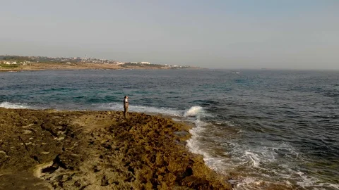 Waves breaking on a rocky beach. Beach and sea. 4K Stock Footage 104656016