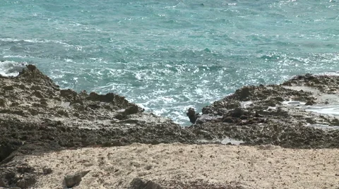Waves Breaking On Rocky Beach on Caribbean Island Stock Footage 54713880