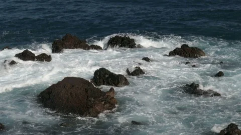 Waves breaking on rocky beach Stock Footage 70668622