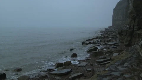 Waves Breaking On A Rocky Beach Long Shot 스톡 동영상 144440800