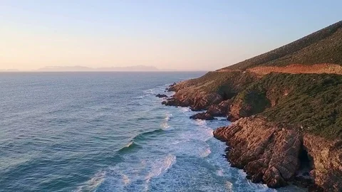 Waves breaking on rocky coast Stock Footage 71615274