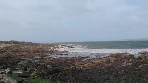 Waves Breaking on Rocky Coast at John O'Groats Looking West Stock Footage 332070298