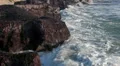 Waves breaking rocky island. Close-up view HD Footage