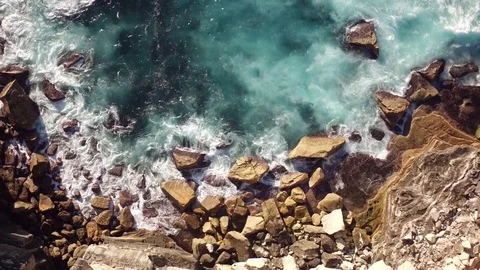 Waves breaking on rocky shoreline Stock Footage 72605428