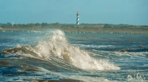 Waves breaking with Saint Augustine Lighthouse in the background Stock Photos