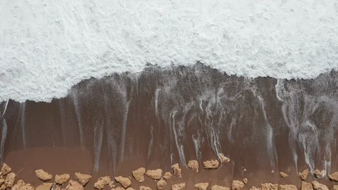 Waves breaking on sand beach Stock Footage 115169392