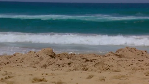 Waves Breaking with sand foreground Focus Pull Stock Footage 76486241