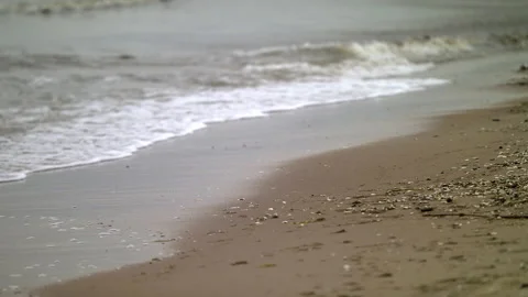 Waves Breaking on a Sandy Beach - Close Up Shot Stock Footage 130731765