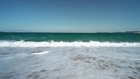 Waves breaking on Sandy Beach in Slow Motion. Sand Beach in Greece 스톡 동영상 197440396