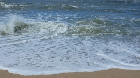 Waves breaking on sandy beach as water flows over the sand Video stock 108195382