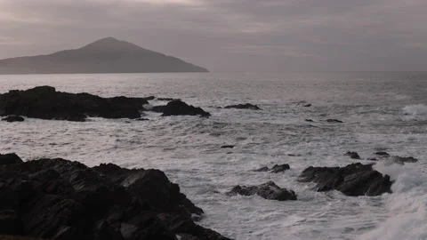 Waves Breaking on Sea Stacks and a Cliff's Edge. Achill Island, Ireland. 4K60 Stock Footage 239548073