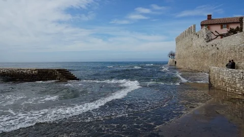 Waves breaking at see side promenade in Novigrad Stock Footage 88201454