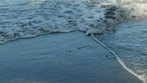 Waves breaking on shore across each other Stock Footage 260370624