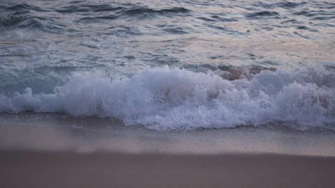 Waves breaking on shore at dusk slow motion Stock Footage 168651659