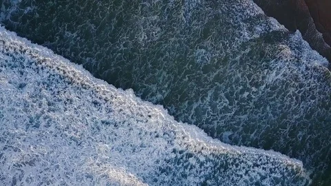 Waves breaking on shore Stock Footage 71615049