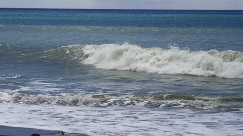 Waves breaking on shore Stock Footage 88831954