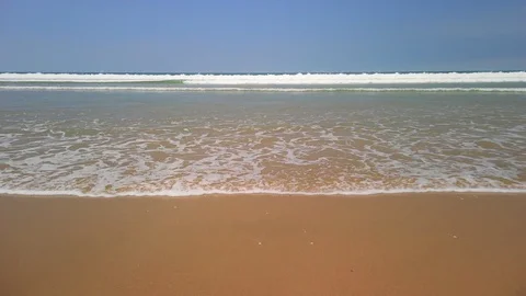 Waves breaking on the shore Stock Footage 128270960