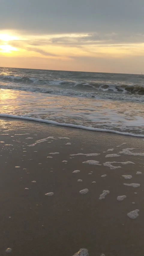 Waves breaking on the shore Stock Footage 283348481