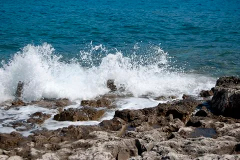 Waves breaking on the shore Stock Photos