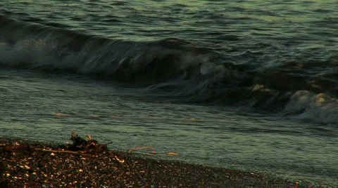 Waves breaking on shore with sand Stock Footage 298964