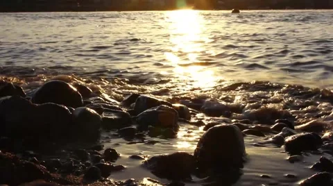 Waves breaking on the shore, sunset Stock-Footage 48750442
