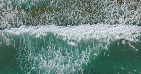 Waves breaking on shore. Top down view of beautiful seascape. Aerial view Stock Footage 191717507