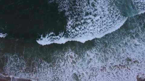Waves breaking at shoreline bird eye view  Stock Footage 261706341