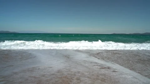 Waves breaking in Slow Motion on Greek Beach. Agean Sea in Greece Stock Footage 197441499