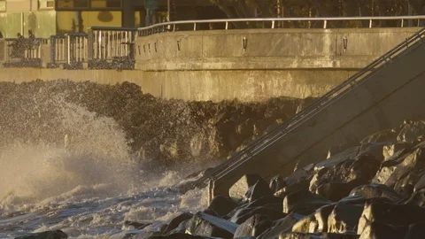 Waves breaking in slow motion on the shoreline at sunset 스톡 동영상 88288655