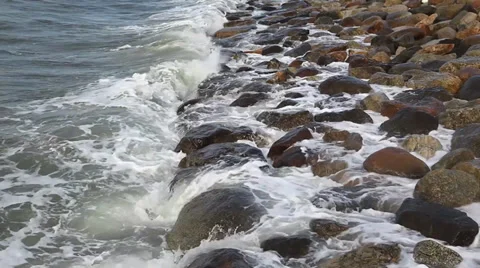 Waves breaking on a stony beach Video stock 36220029