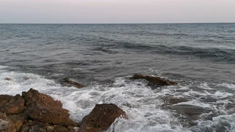 The waves breaking on the stony shore Stock Footage 132813476