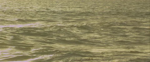 Waves breaking at sunset, anamorphic Stock Footage 46032691