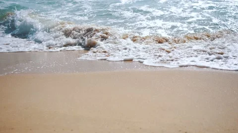 Waves breaking to texture from white sea foaming on the beach. Stock Footage 156338289