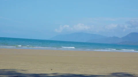 Waves Breaking on Tropical Beach with Pale Blue Water and Golden Sand, Low Tide Stock Footage 314937963