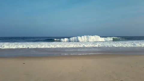 Waves breaking, white foam, blue sky and sea, in Itacoatiara beach, Brazil. Stock Footage 119393367