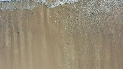 Waves breaking on a white sand beach Stock Footage 147907290