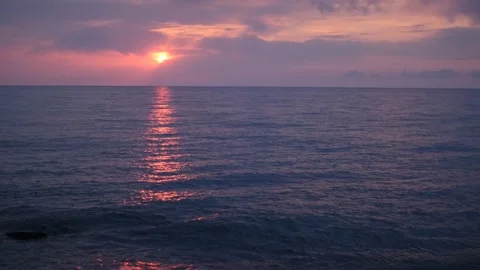 Waves breeze on the sea. The coast with rocks..The pebbles are small. Sunset. Th Stock Footage 162153653