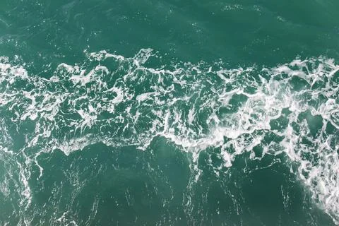 Waves bubbles ocean water background. Stock Photos