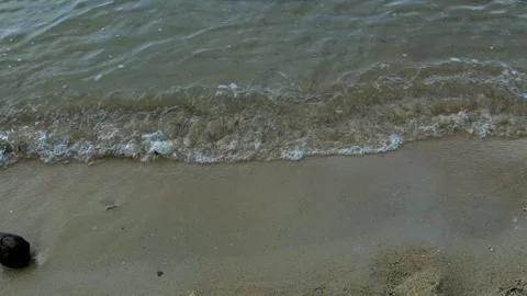Waves on a calm beach in the morning Stock Footage 280676074