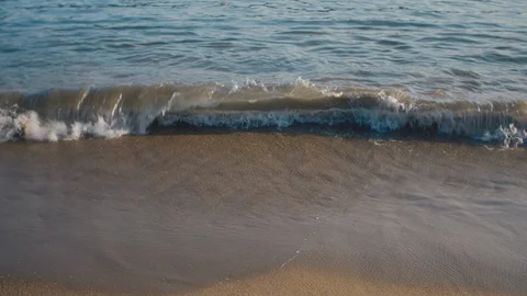 Waves calmly washing on sandy beach. Stock Footage 119117689